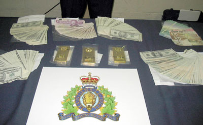 Cash and Gold Bars Seized During Heaven's Stairway Bust