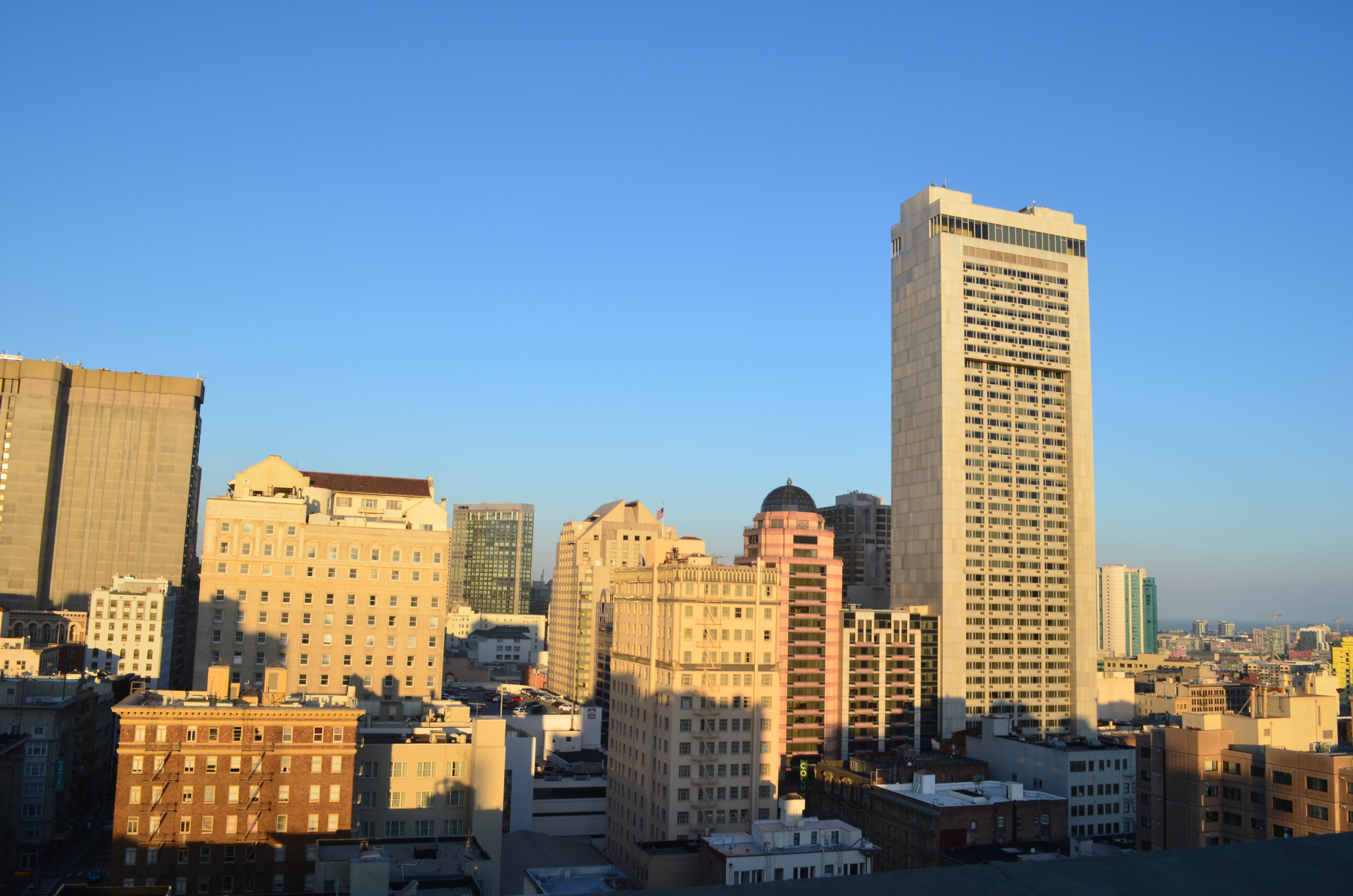 Photo of buildings of downtown San Francisco taken from the rooftop of a building in the middle of downtown.